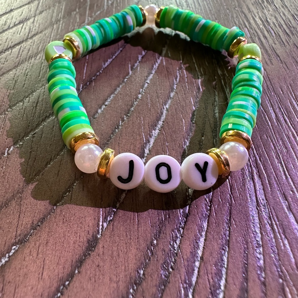 Hand Crafted Green and Gold Elastic “Joy” Bracelet